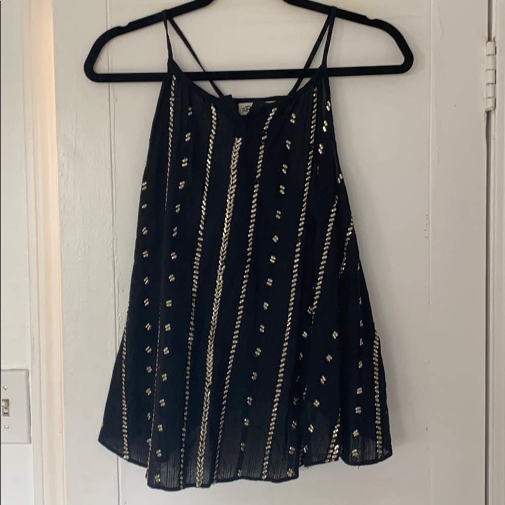 Black shirt with gold beads